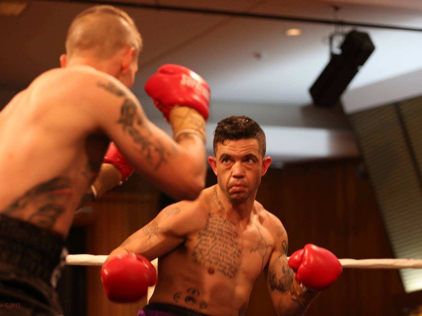 Joe Williams in the boxing ring, facing an opponent