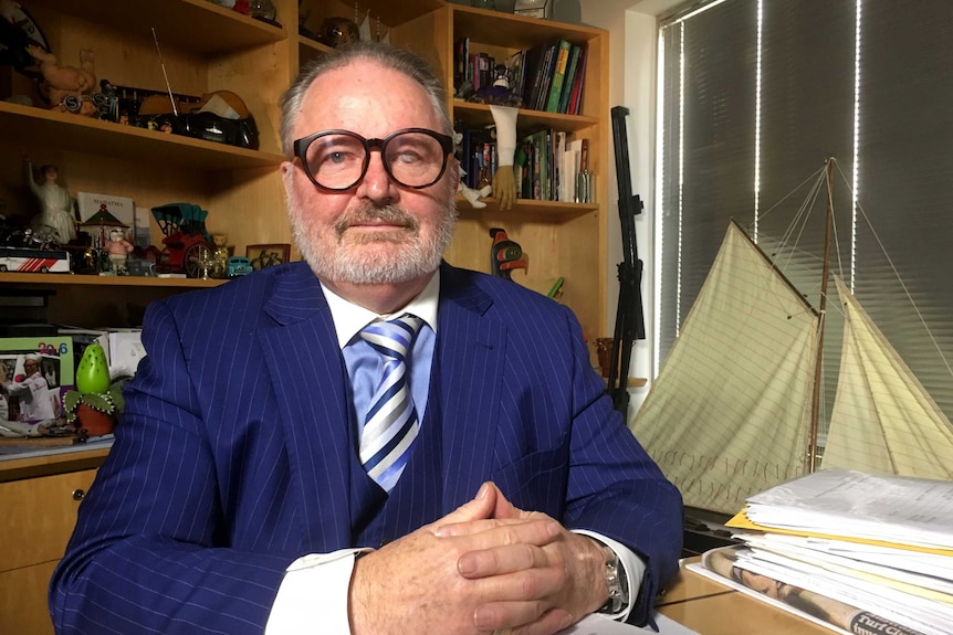 Peter Jess, the manager for Essendon player Nathan Lovett-Murray, sitting in his office.