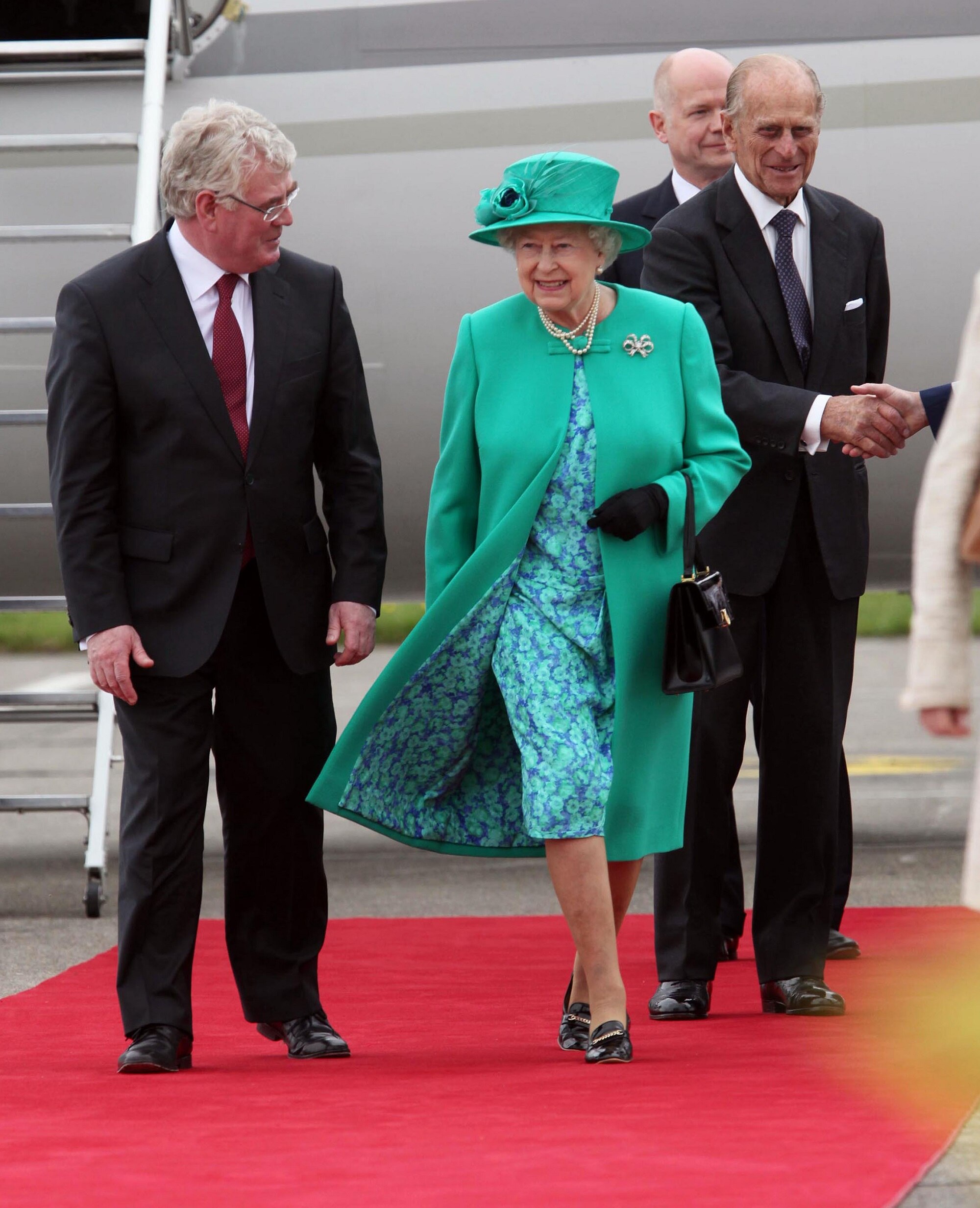 Queen Elizabeth's most iconic fashion moments, from her coronation to the 'green screen' dress
