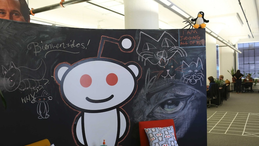 A Reddit mascot is shown at the company's headquarters in San Francisco