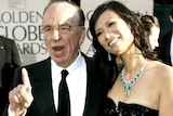 Rupert Murdoch and his wife Wendi Deng arrive at the 2007 Golden Globe Awards in Beverly Hills, California.