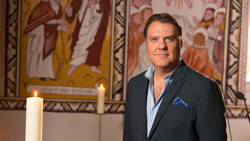 Singer bryn terfel poses for a portrait by some candles