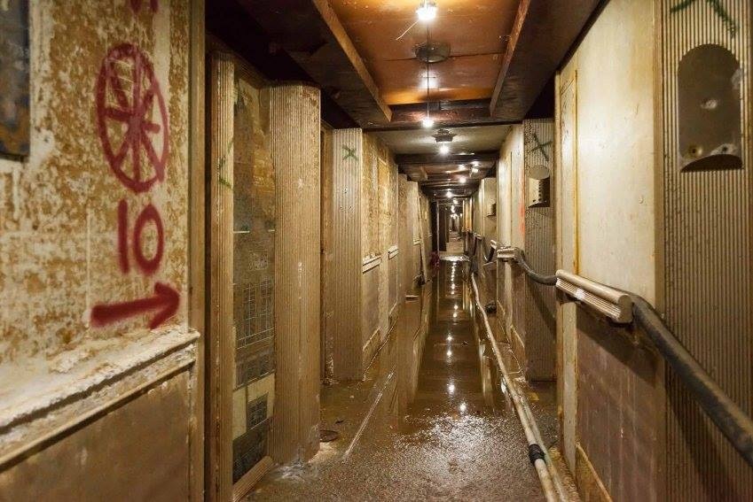 Muddy, water-damaged hallway of the shipwrecked Costa Concordia