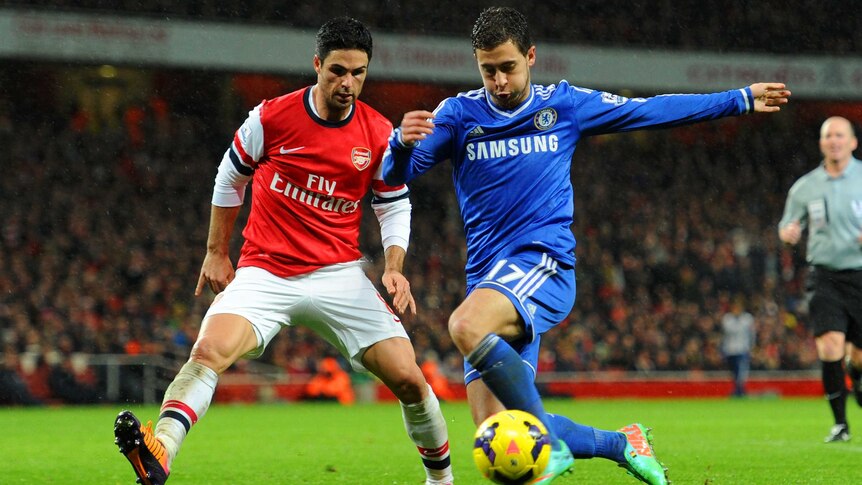 Arsenal's Mikel Arteta marshals Chelsea's Eden Hazard.