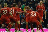 Liverpool players congratulate Raheem Sterling (3rd R) after his League Cup goal against Chelsea