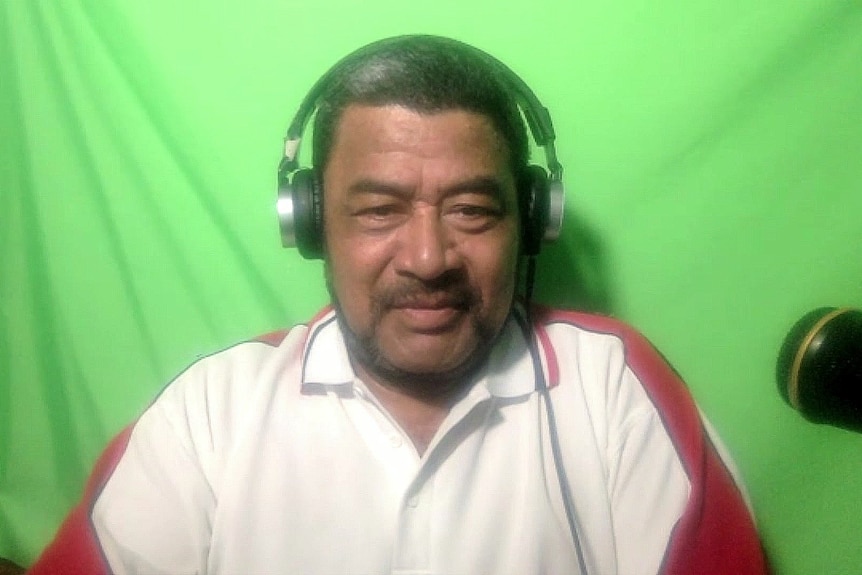 a man wearing headphones looking down