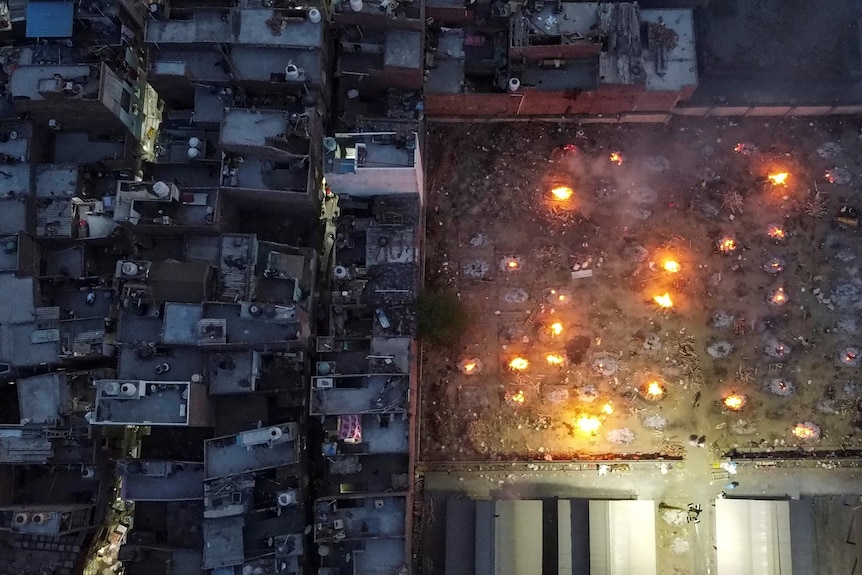 A mass cremation of victims who died from COVID-19 are seen rom the air above a crematorium ground.