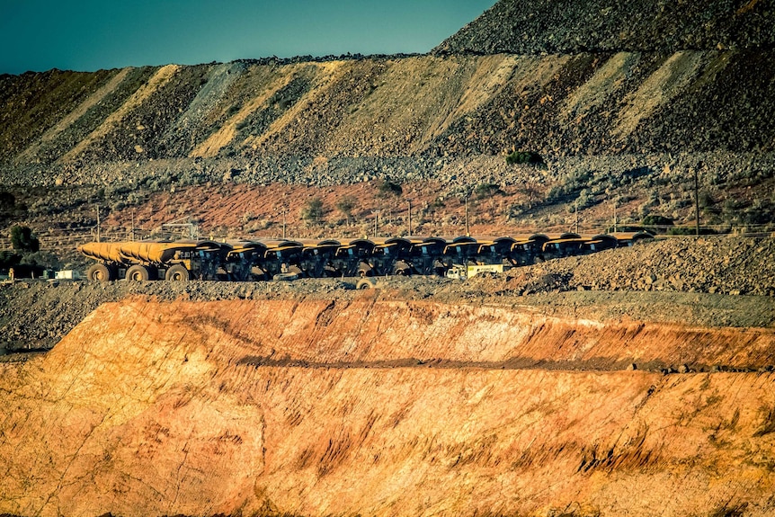 Big trucks line up at Kalgoorlie's Super Pit gold mine