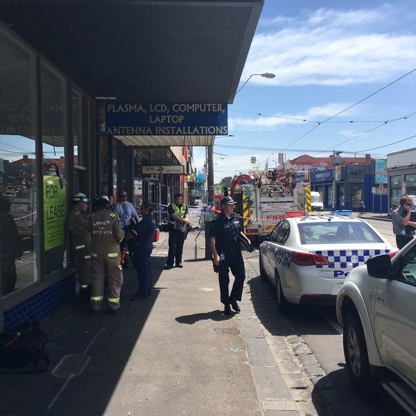 Forensic officers at shop fire