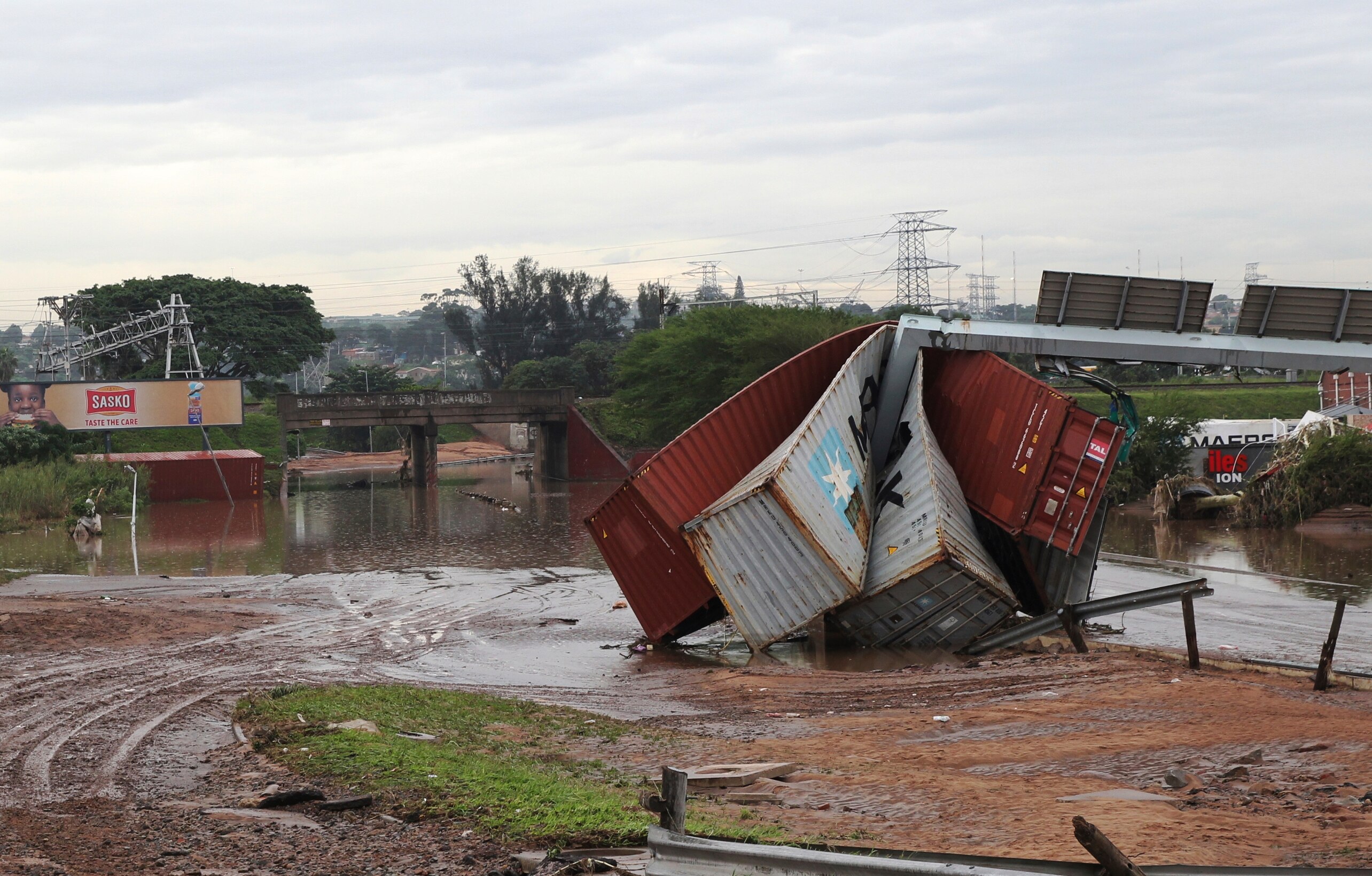 Shipping containers left in a jumbled pile after flooding