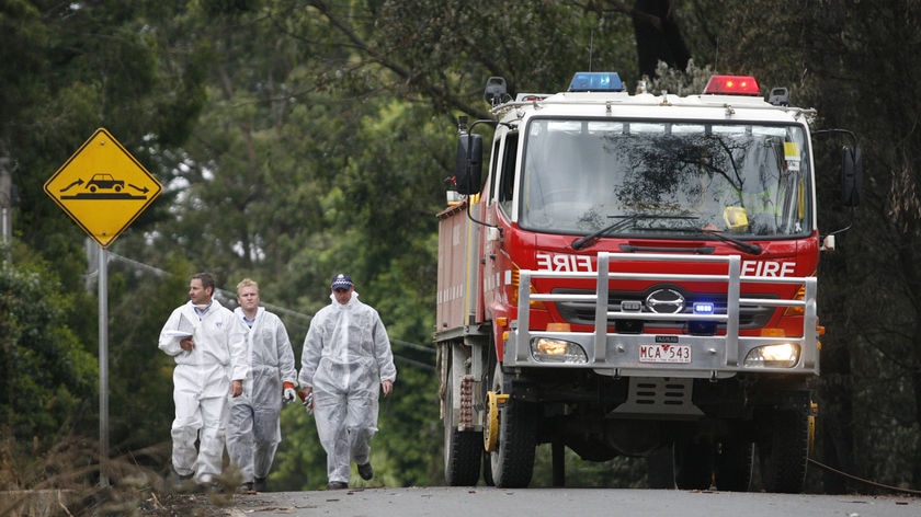 Grisly task: It's thought the death toll will rise when more burned-out homes are searched.