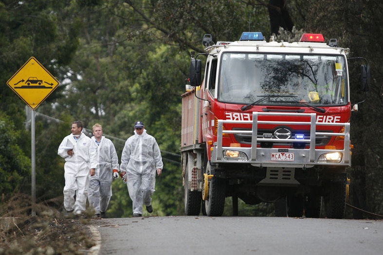 Grisly task: It's thought the death toll will rise when more burned-out homes are searched.