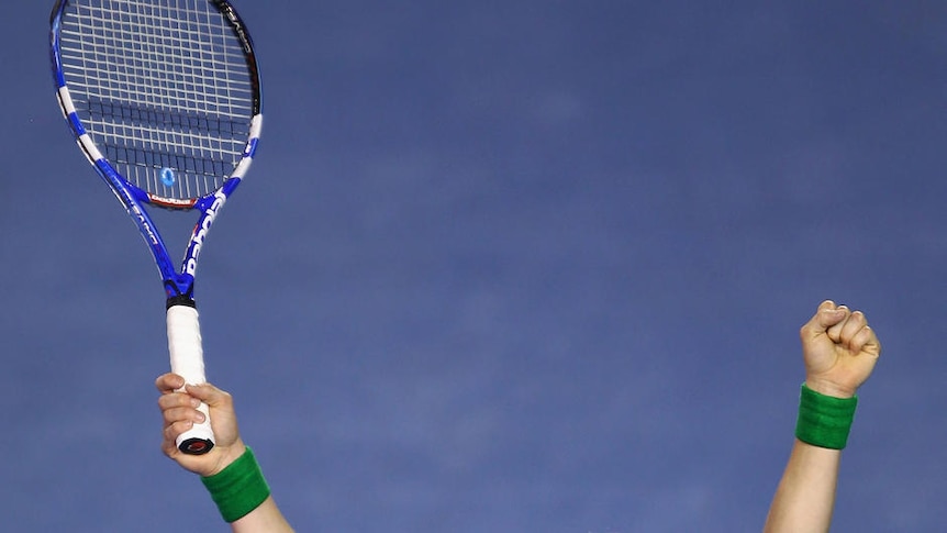 On top ... Kim Clijsters celebrates winning the Australian Open final