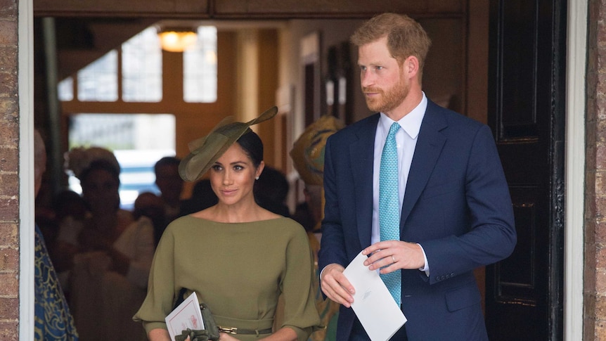 Britain's Prince Harry and Meghan Duchess of Sussex leave after the christening service