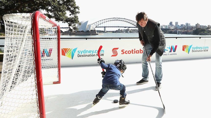 Wayne Gretzky plays hockey with kid in front of Sydney Harbour Bridge