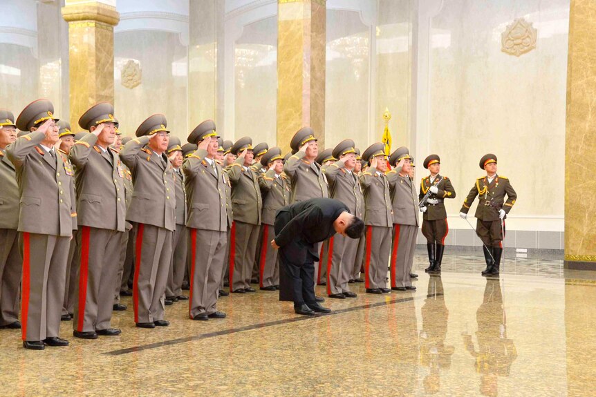 Kim Jong Un bows at Kumsusan Palace