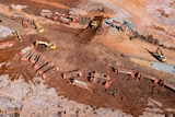 An aerial view of the massive clean-up operation at the site of a remote train derailment.   