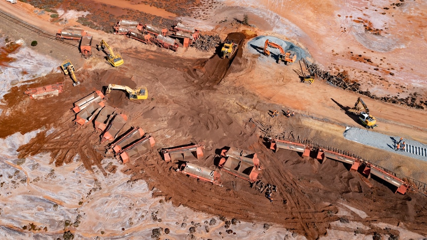 An aerial view of the massive clean-up operation at the site of a remote train derailment.   