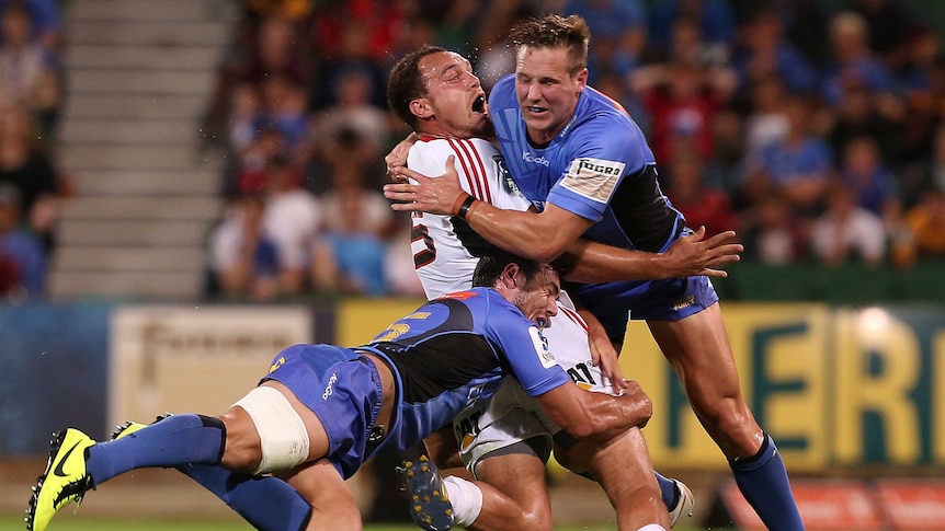 Shunted ... Israel Dagg comes off second best against the Force's Jayden Hayward and Ed Stubbs.