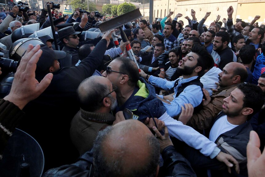 Christians clash with riot police in front of Cairo’s Coptic Cathedral