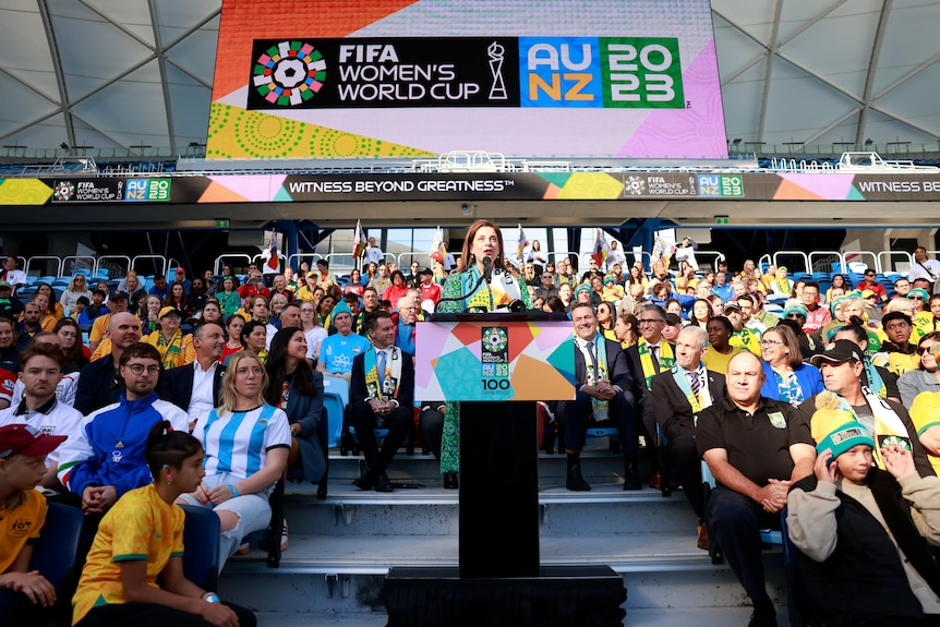A person speaks at a ceremony commemorating the upcoming women's world cup