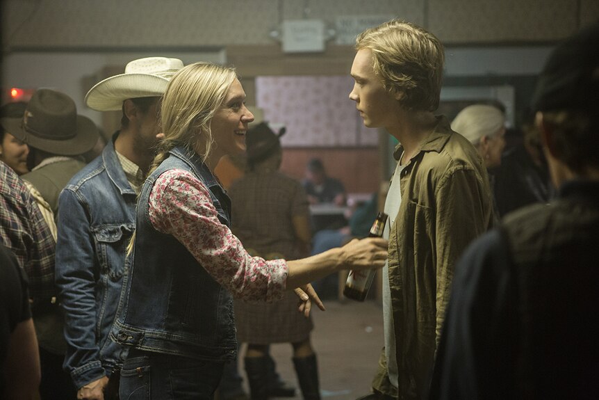 Colour still of Charlie Plummer and Chloë Sevigny conversing in a hall 2018 film Lean on Pete.