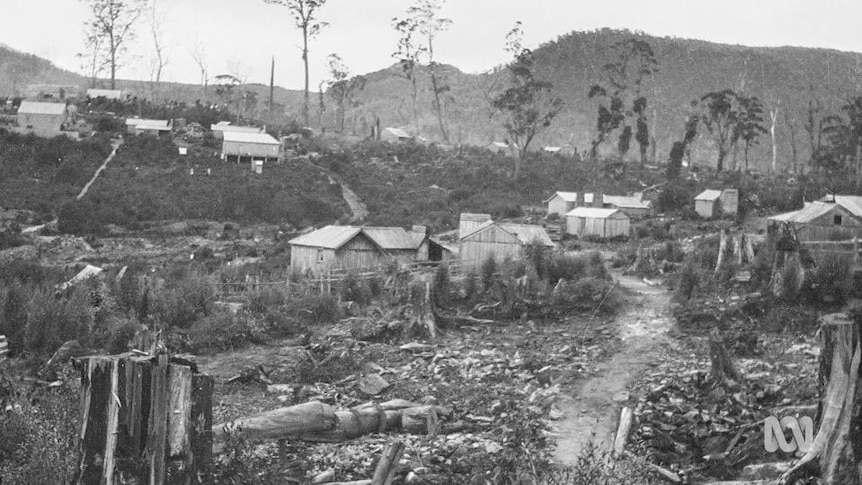 Old photograph of wooden buildings in mountainous area