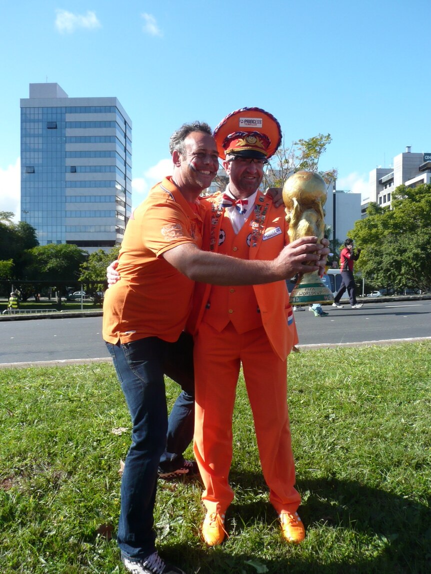 Dutch fans pose with imitation World Cup trophy