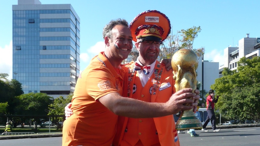 Dutch fans pose with imitation World Cup trophy