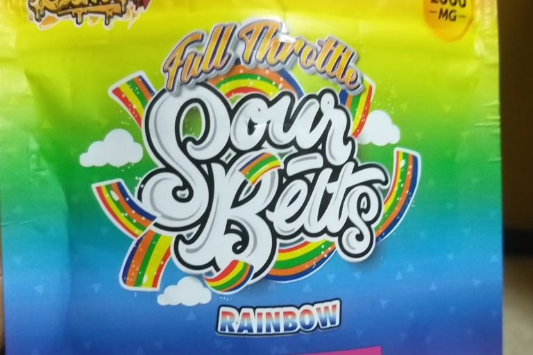 A packet of sour candy in rainbow colour 
