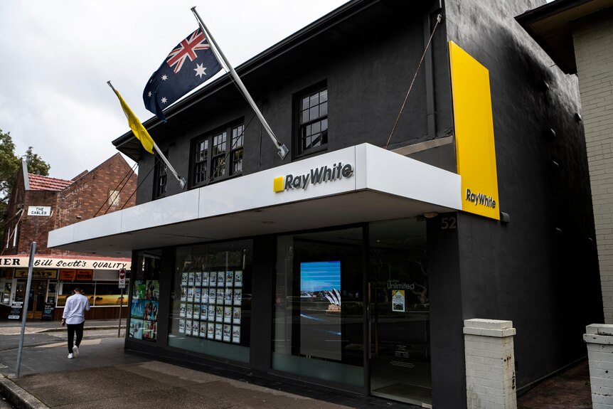 The exterior of a Ray White real estate agency building.