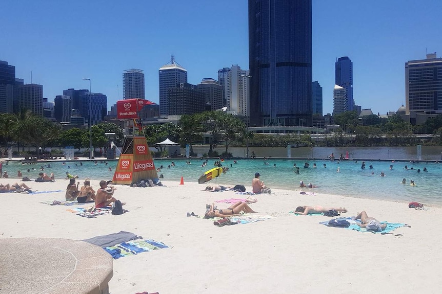 People cool off at South Bank beach in Brisbane's CBD about noon on Wednesday January 18, 2017