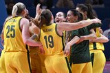 Opals players embrace as they celebrate winning bronze at the World Cup.