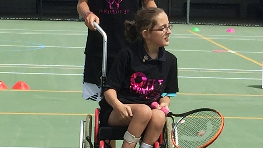 Katherine Russell, 11, has been playing tennis for more than a year in the diversity division at FuturePros Tennis Academy.