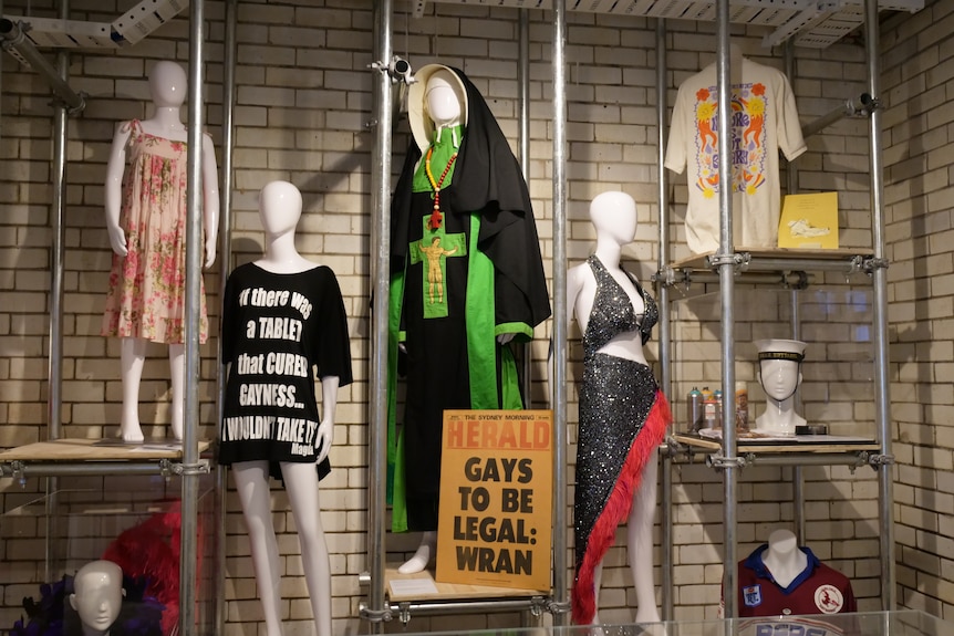 A display of different costumes carrying protest slogans