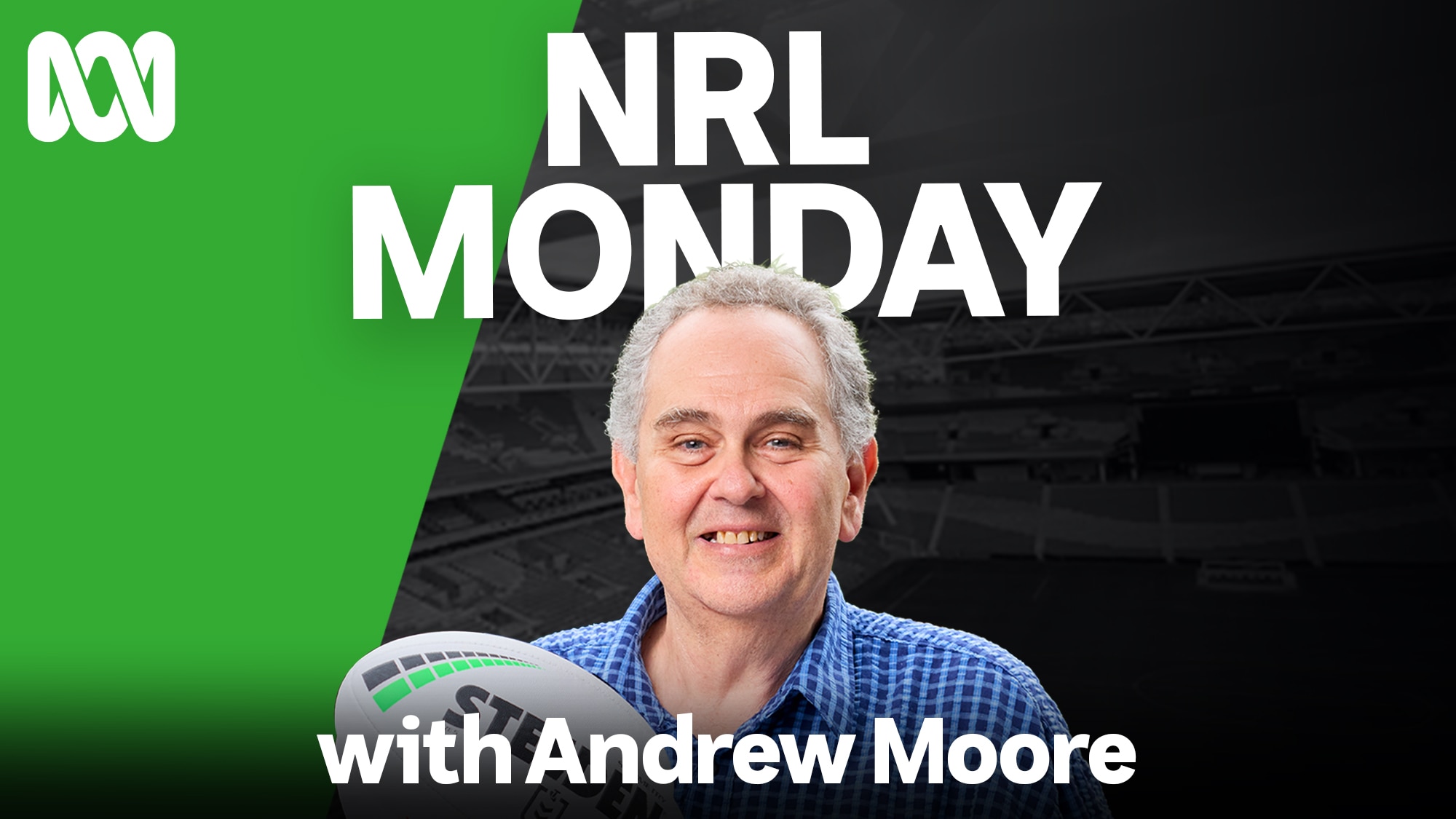 Andrew Moore stands with stadium in background holding NRL football