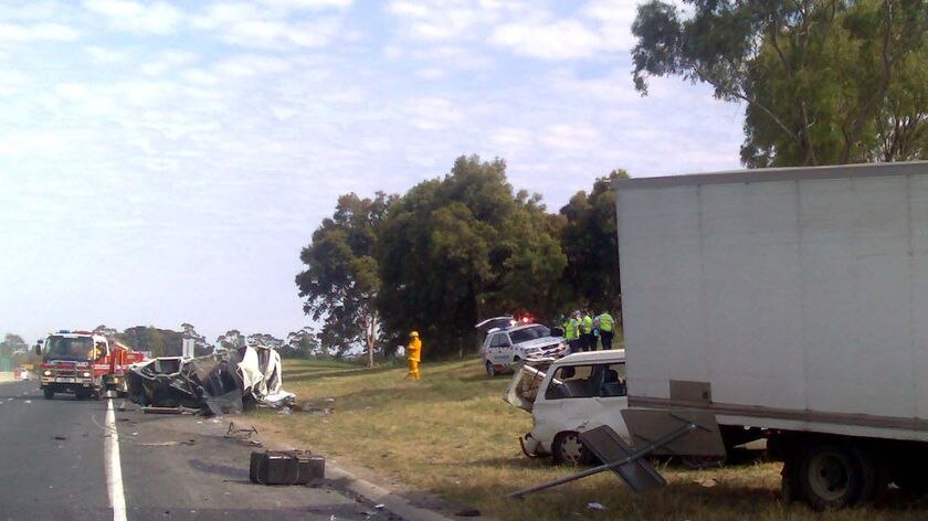 Paramedic Dave Llewelyn says the trucks have been 'sprayed across the freeway'.