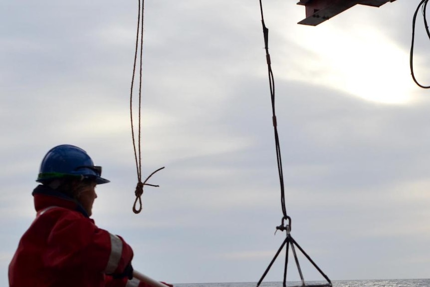 A sensor used to gauge the health of phytoplankton is brought aboard the Aurora Australis.