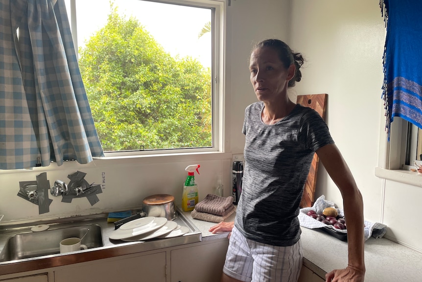 A woman in her kitchen.