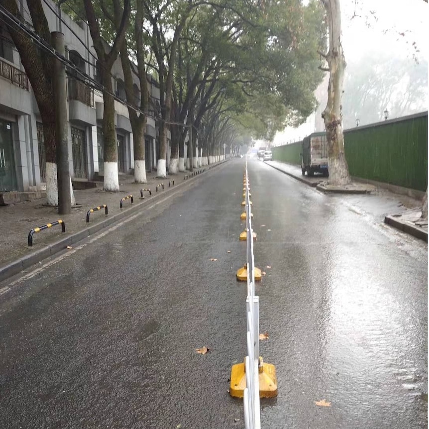 An empty street in Wuhan, with nobody pictured on the road or side walk.