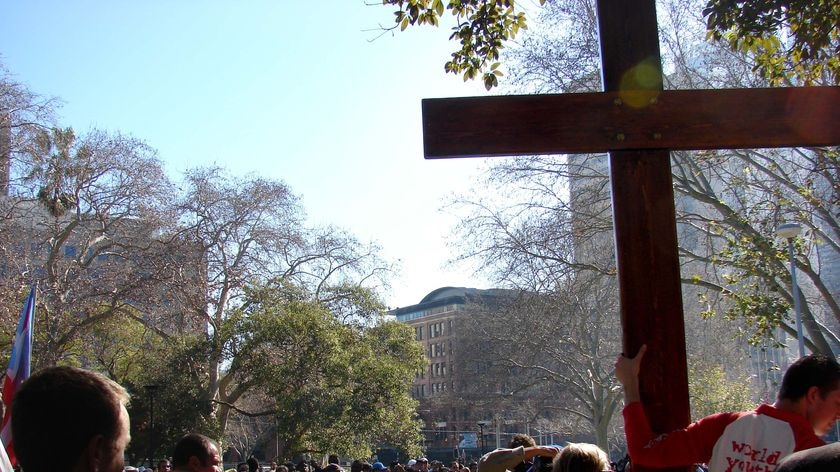 The World Youth Day cross is shown to the crowd