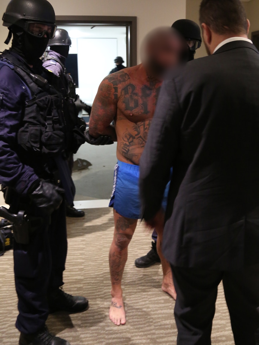 A Bandidos bikie gang member being arrested.