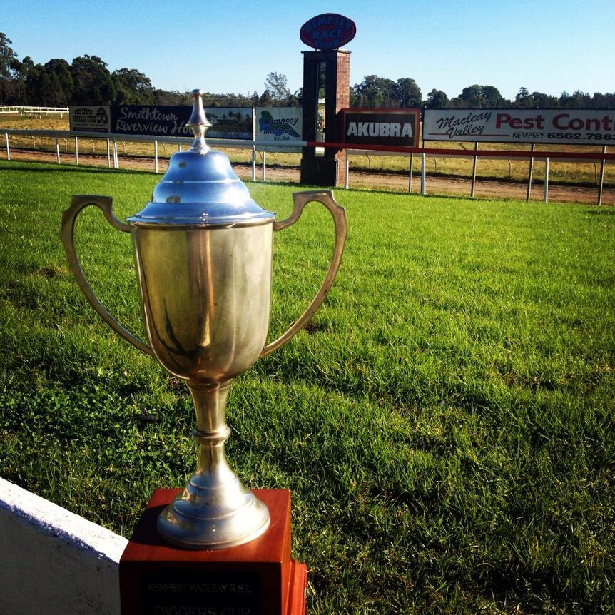 The Kempsey Cup sits on the railing near the race track at Kempsey Showground.
