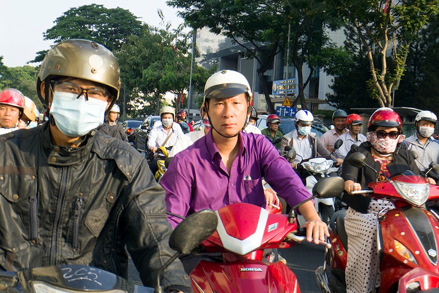 Motorcyclists on Ho Chi Minh City's clogged streets.