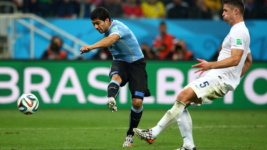 Luis Suarez scores his second goal for Uruguay against England in Sao Paulo.