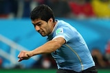 Luis Suarez scores his second goal for Uruguay against England in Sao Paulo.
