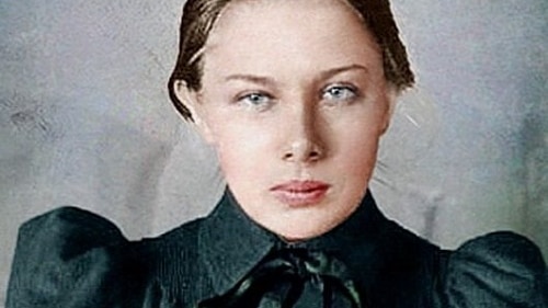 A stern looking woman in black shirt
