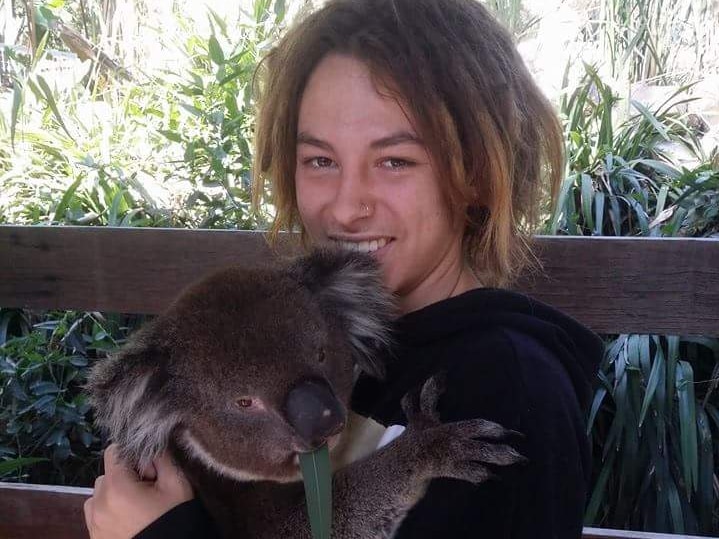 Adelaide teenager Ruan Beetge holding a koala