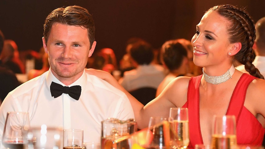 Patrick Dangerfield (L) is congratulated by his wife Mardi after winning the 2016 Brownlow Medal.