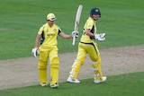 Australia's Nicole Bolton celebrates her half-century against the West Indies with Beth Mooney.
